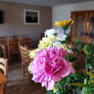 A picture of flowers laid out in our large kitchen and dining area of our Donegal B&B