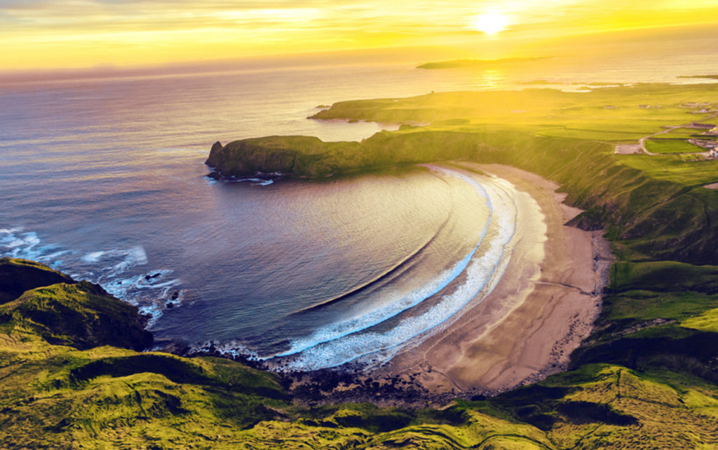 This picture shows a beautiful sunset over SIlver Strand beach, taken from atop the nearby cliff edge